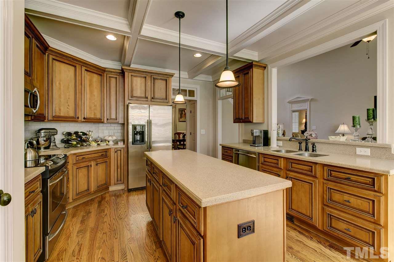 5804 Turner Store Lane Raleigh, NC 27603 - Photo 8 of 25 a kitchen with a stove a sink and a refrigerator