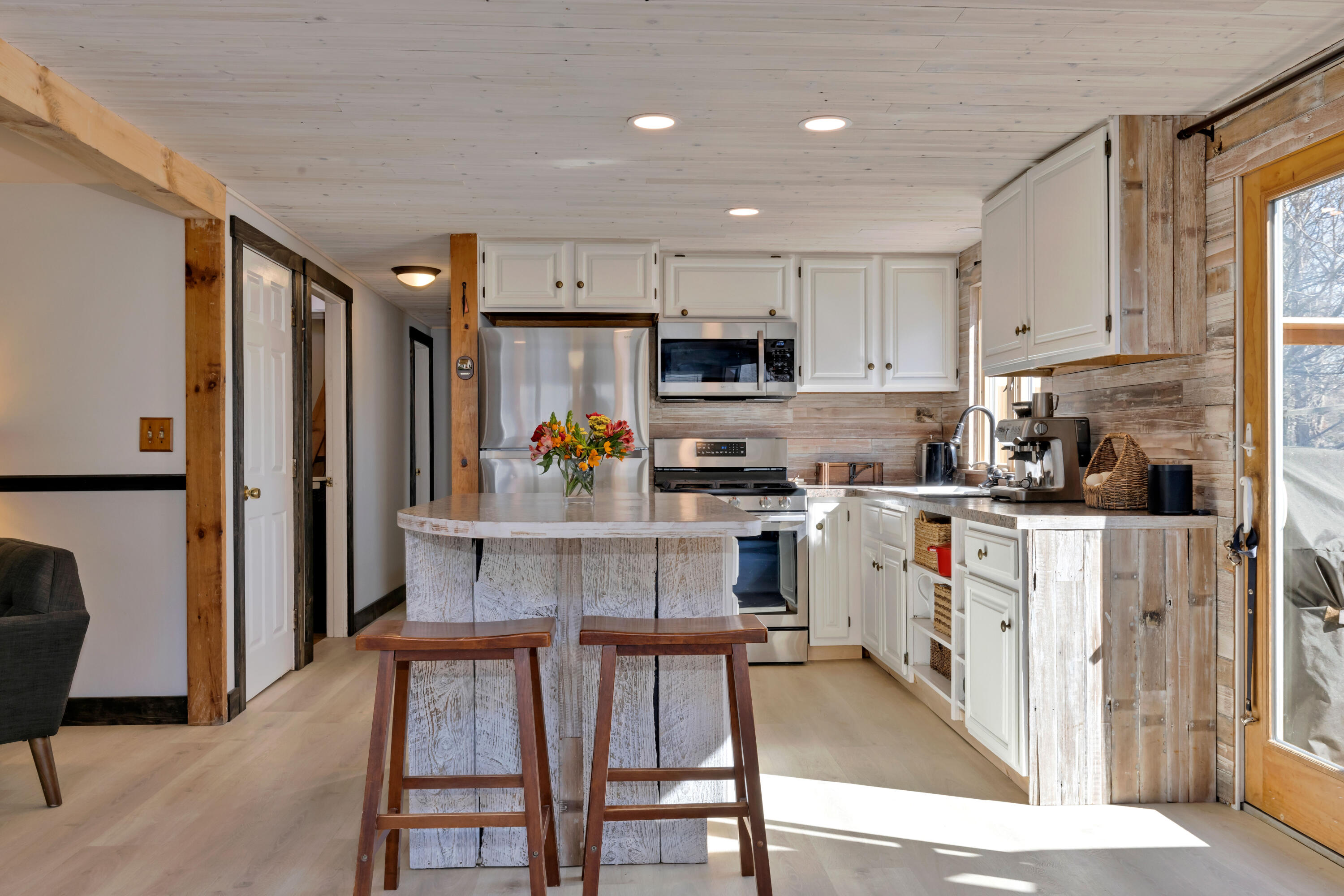 110 Kelley Road Hyannis, MA 02601 - Photo 11 of 49 a kitchen with white cabinets and stainless steel appliances