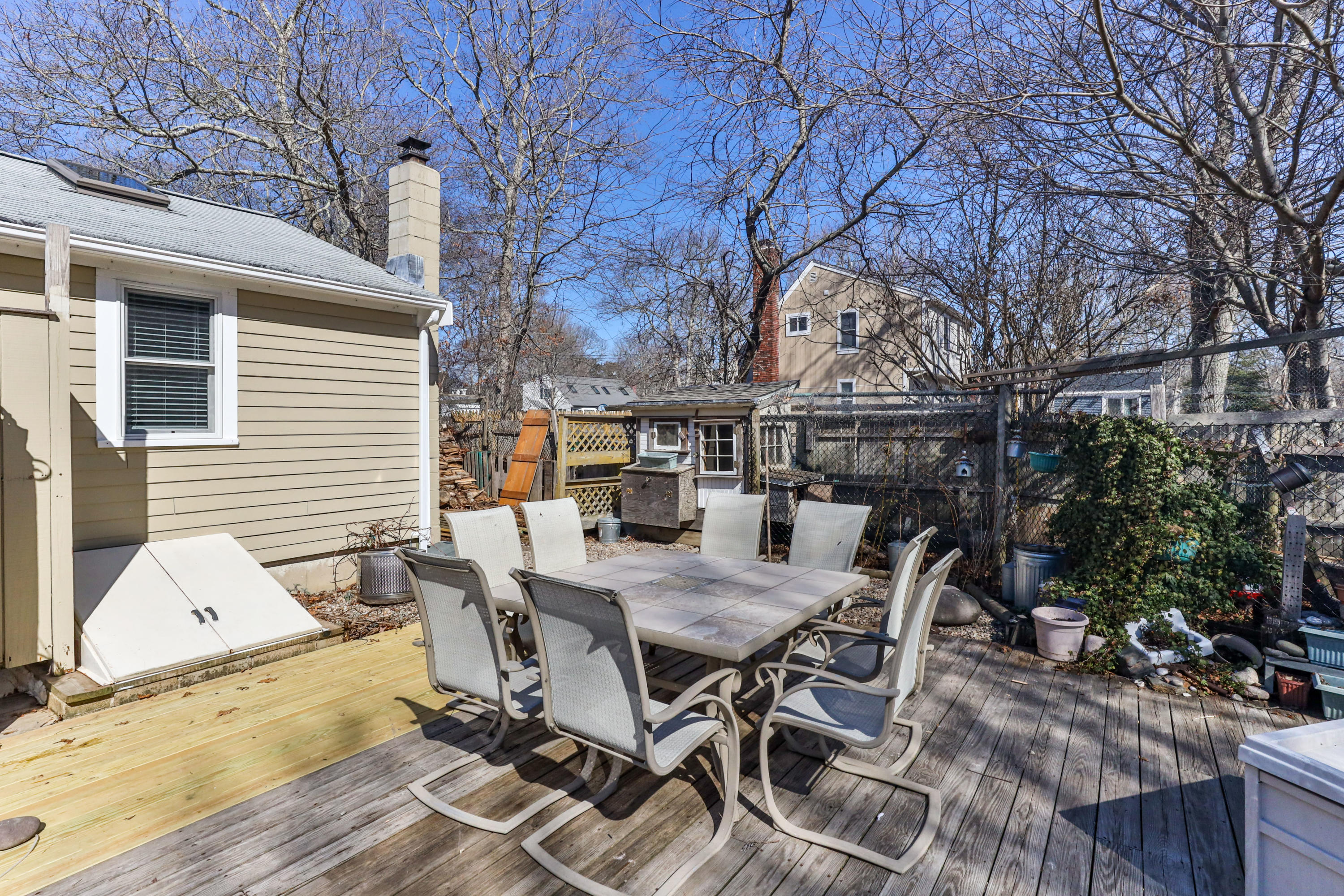 110 Kelley Road Hyannis, MA 02601 - Photo 39 of 49 a view of backyard with table and chairs and wooden fence