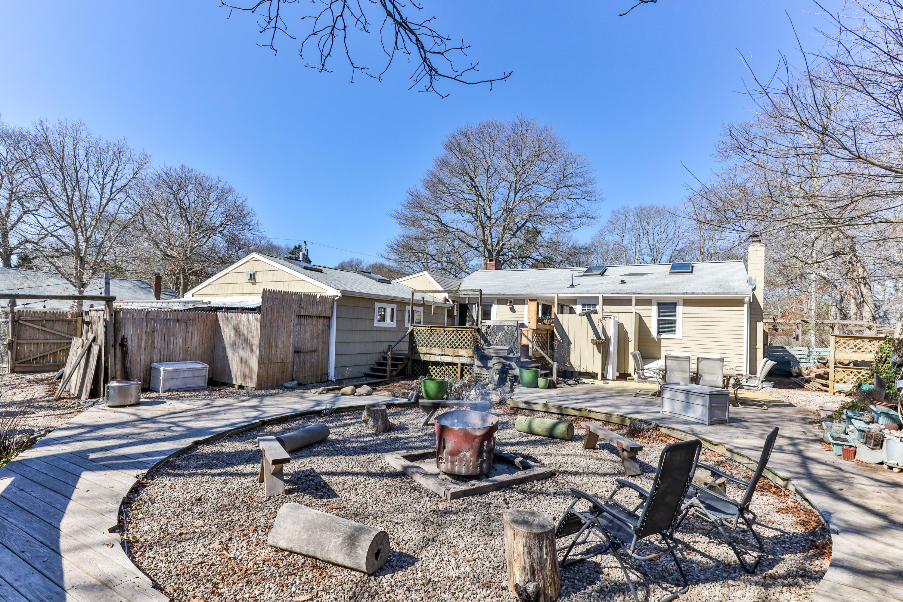 110 Kelley Road Hyannis, MA 02601 - Photo 42 of 49 a view of a patio with couches chairs and a fire pit
