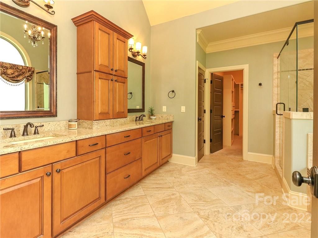 251 Old Post Road Weddington, NC 28173 - Photo 16 of 46 a spacious bathroom with a mirror a double vanity sink and a