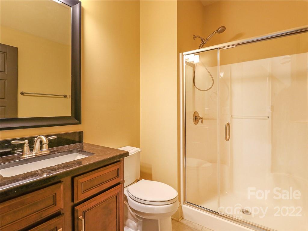 251 Old Post Road Weddington, NC 28173 - Photo 24 of 46 a bathroom with a granite countertop sink toilet and shower