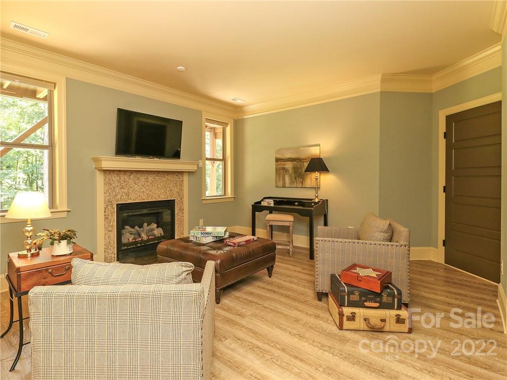 251 Old Post Road Weddington, NC 28173 - Photo 30 of 46 a living room with furniture fireplace and flat screen tv