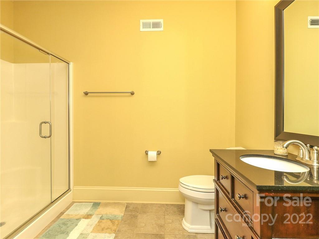 251 Old Post Road Weddington, NC 28173 - Photo 32 of 46 a bathroom with a sink a toilet and shower
