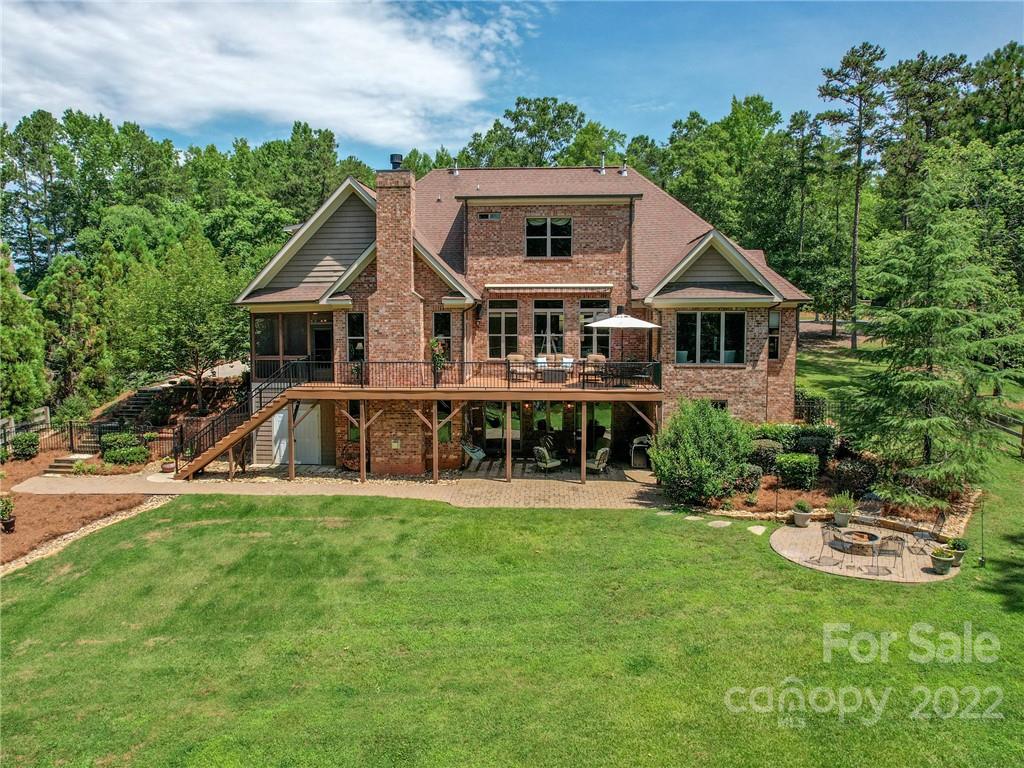 251 Old Post Road Weddington, NC 28173 - Photo 37 of 46 a front view of a house with a garden and trees