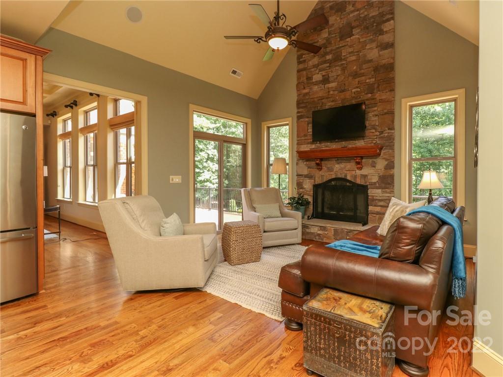 251 Old Post Road Weddington, NC 28173 - Photo 7 of 46 a living room with furniture floor to ceiling window and a fireplace