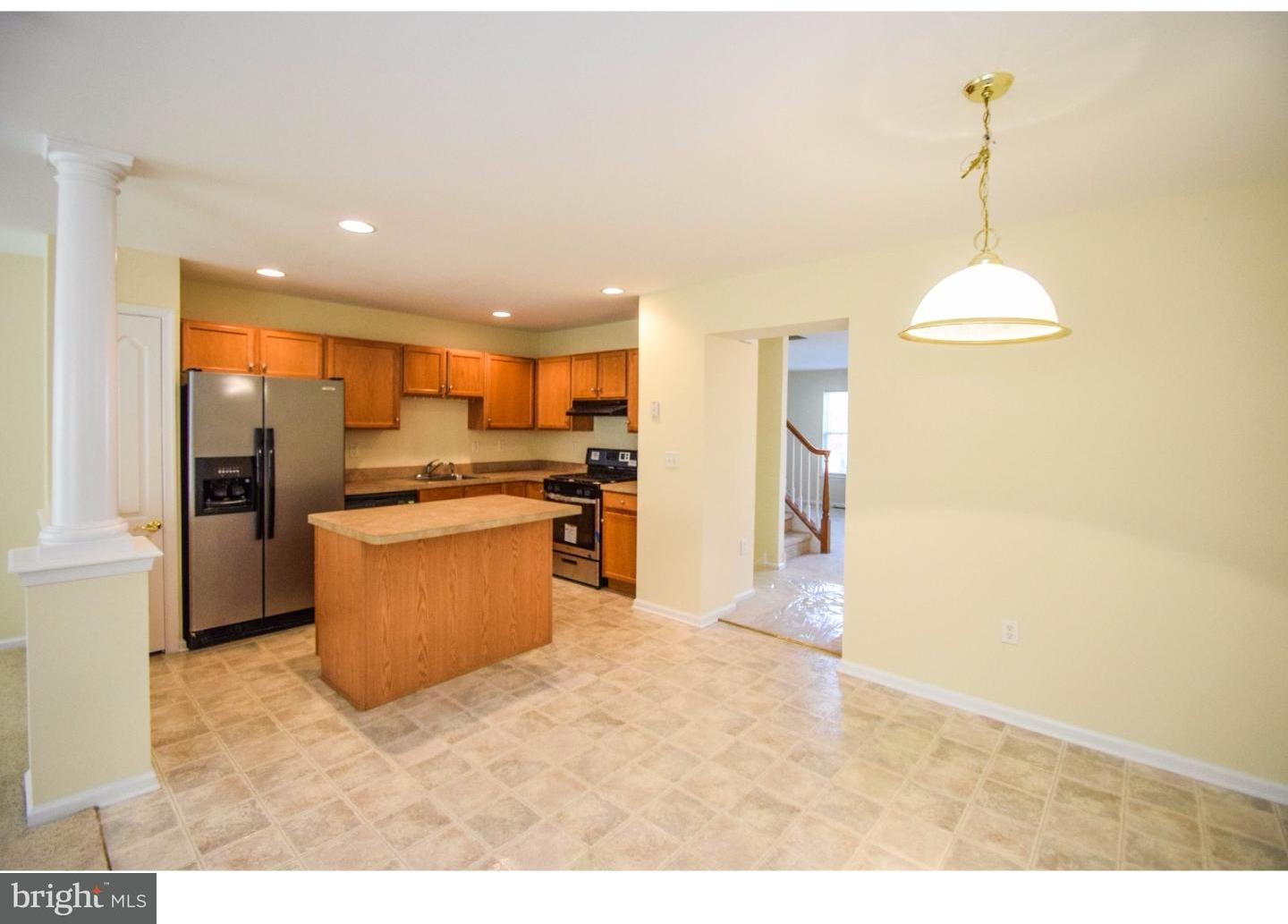 1025 Moore Road Thorofare, NJ 08086 - Photo 11 of 25 a kitchen with refrigerator and cabinets
