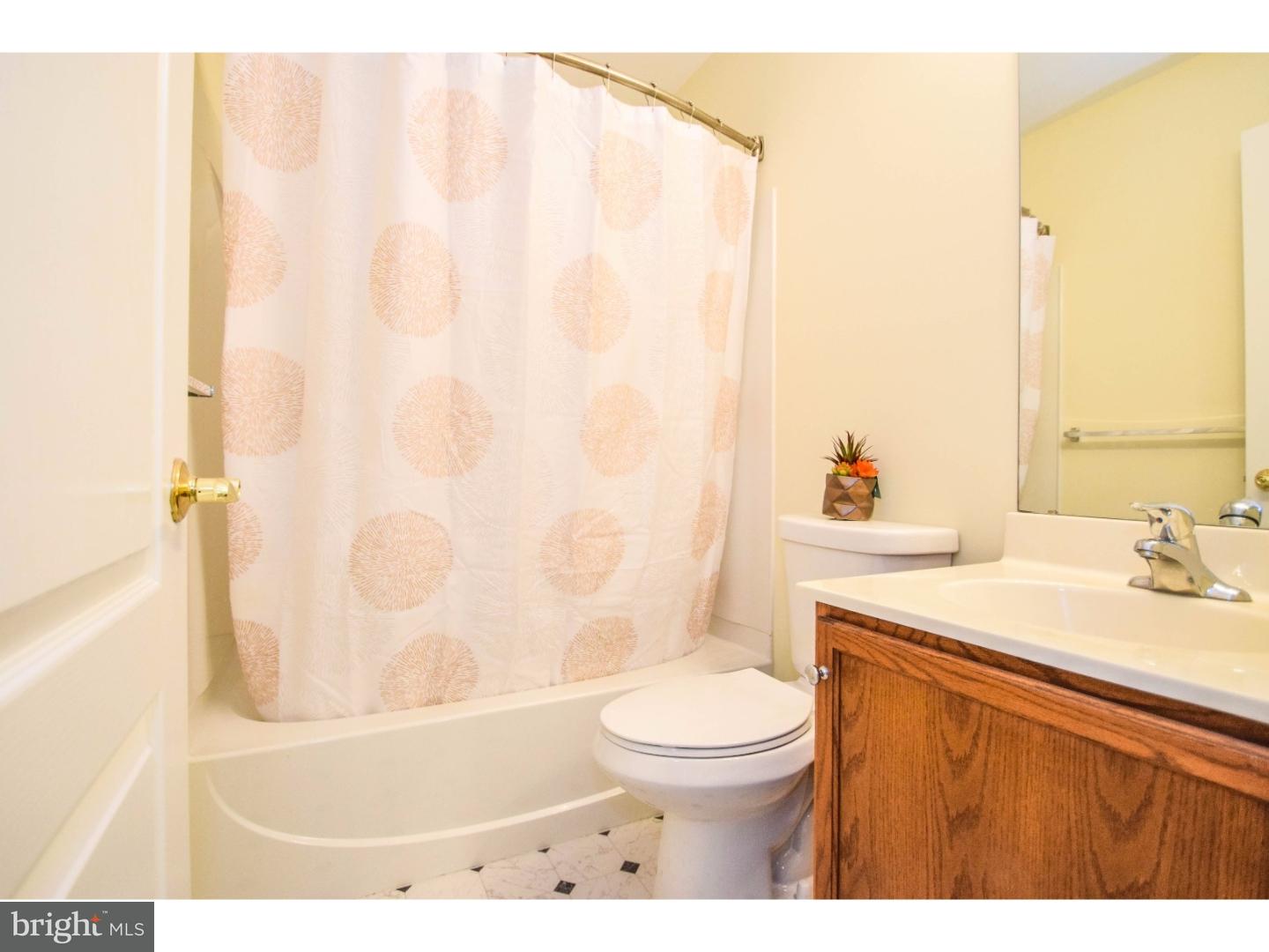 1025 Moore Road Thorofare, NJ 08086 - Photo 22 of 25 a bathroom with a sink a toilet and a bathtub