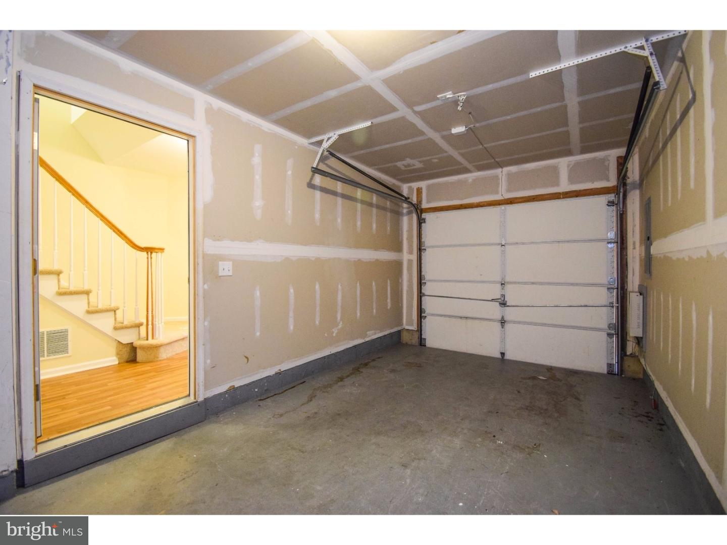 1025 Moore Road Thorofare, NJ 08086 - Photo 25 of 25 a view of an empty room with wooden floor and windows