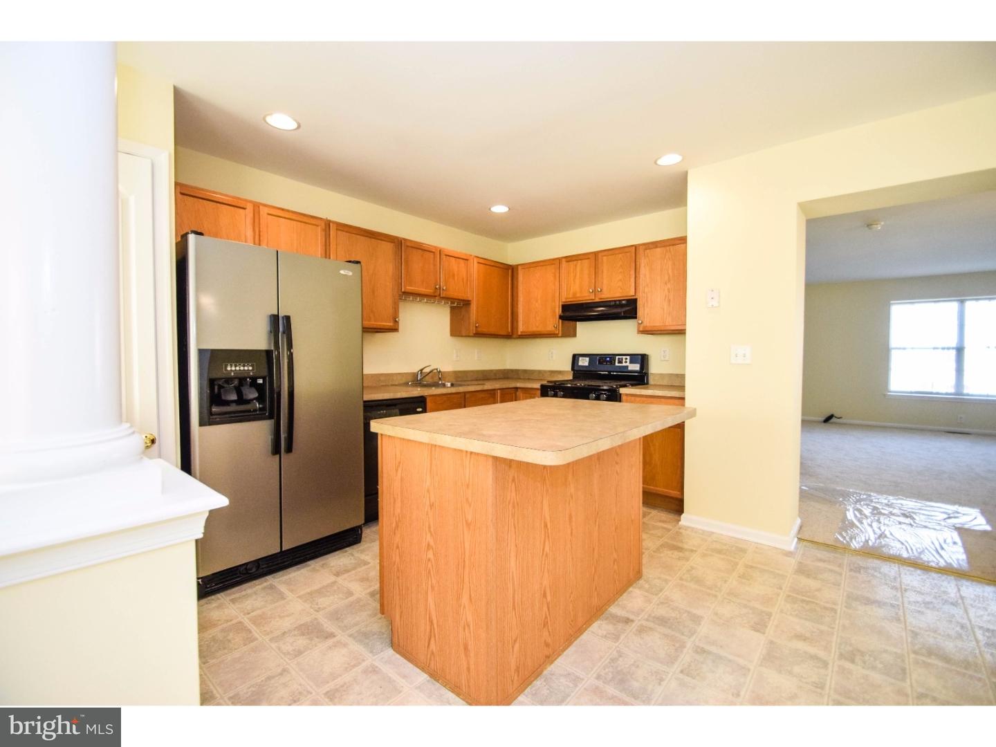 1025 Moore Road Thorofare, NJ 08086 - Photo 9 of 25 a kitchen with stainless steel appliances granite countertop a refrigerator a sink a stove and oven