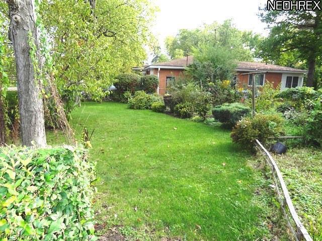 1592 Fairfax Road Akron, OH 44313 - Photo 11 of 14 Back yard is semi enclosed with lots of greenery and a fence