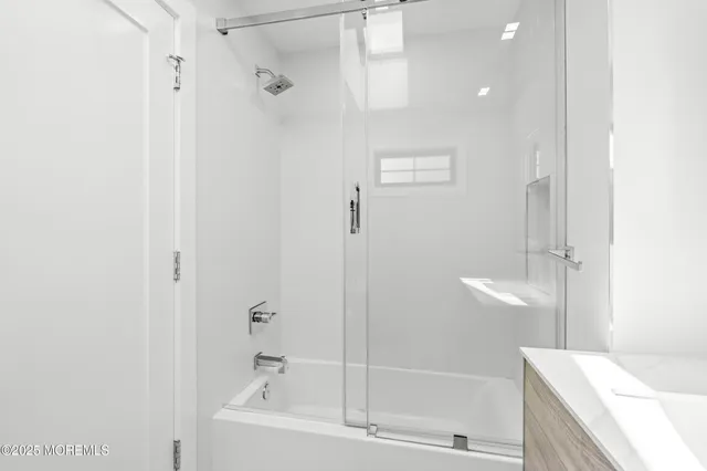 a bathroom with a bathtub and a shower