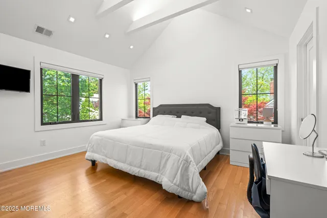 a bedroom with a bed and a chair