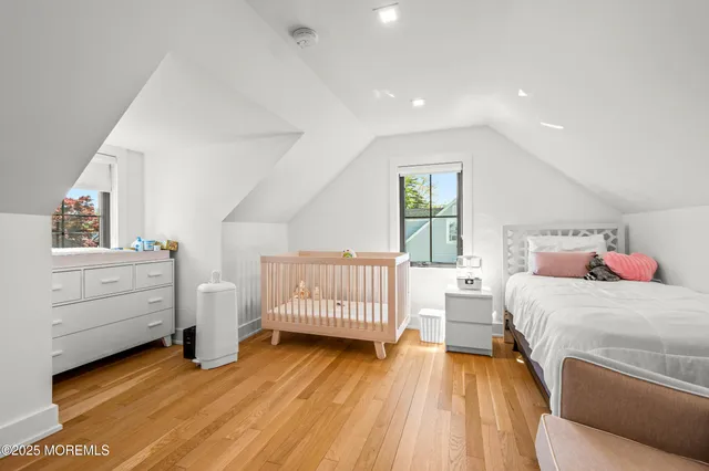 a bedroom with a bed and a view of bedroom