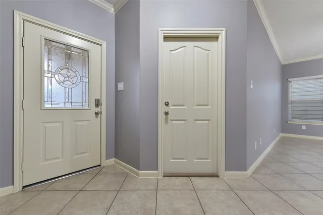a view of an empty room with a kitchen