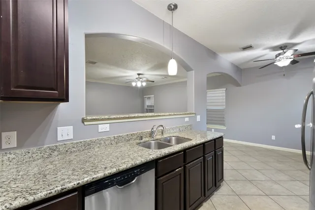 a kitchen with granite countertop stainless steel appliances and granite counter tops
