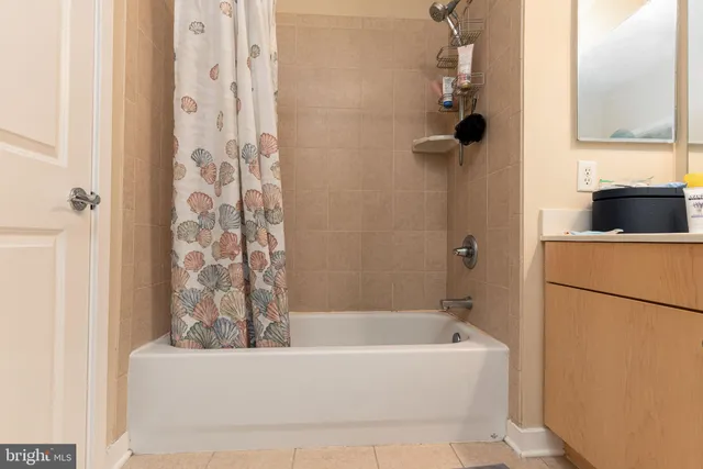 a bathroom with a bathtub and shower