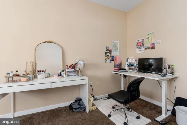 a view of a workspace with furniture