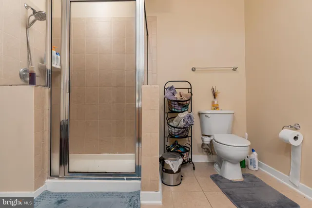 a white toilet sitting next to a bathroom sink