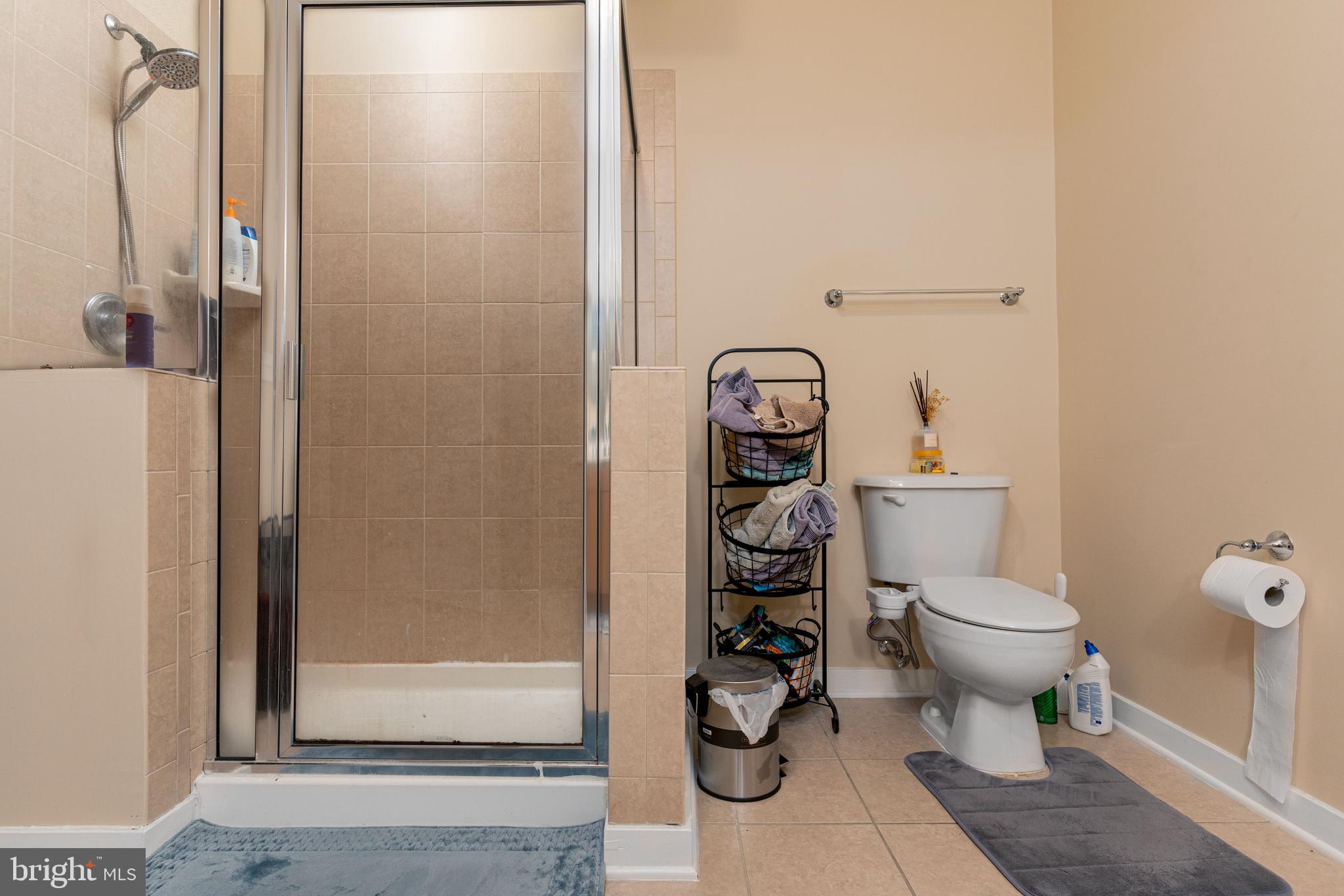 3201 St Paul Street, Unit 422 Baltimore, MD 21218 - Photo 22 of 27 a white toilet sitting next to a bathroom sink