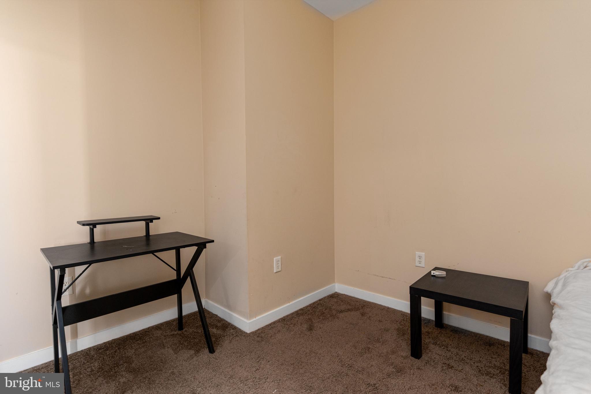 3201 St Paul Street, Unit 422 Baltimore, MD 21218 - Photo 25 of 27 a view of a room with table and a chair