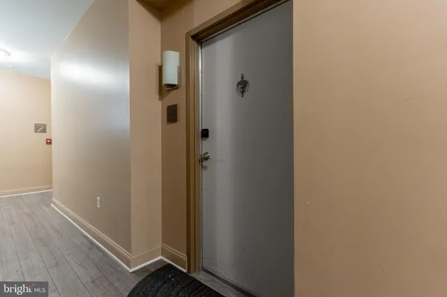 a view of living room with furniture and a large window