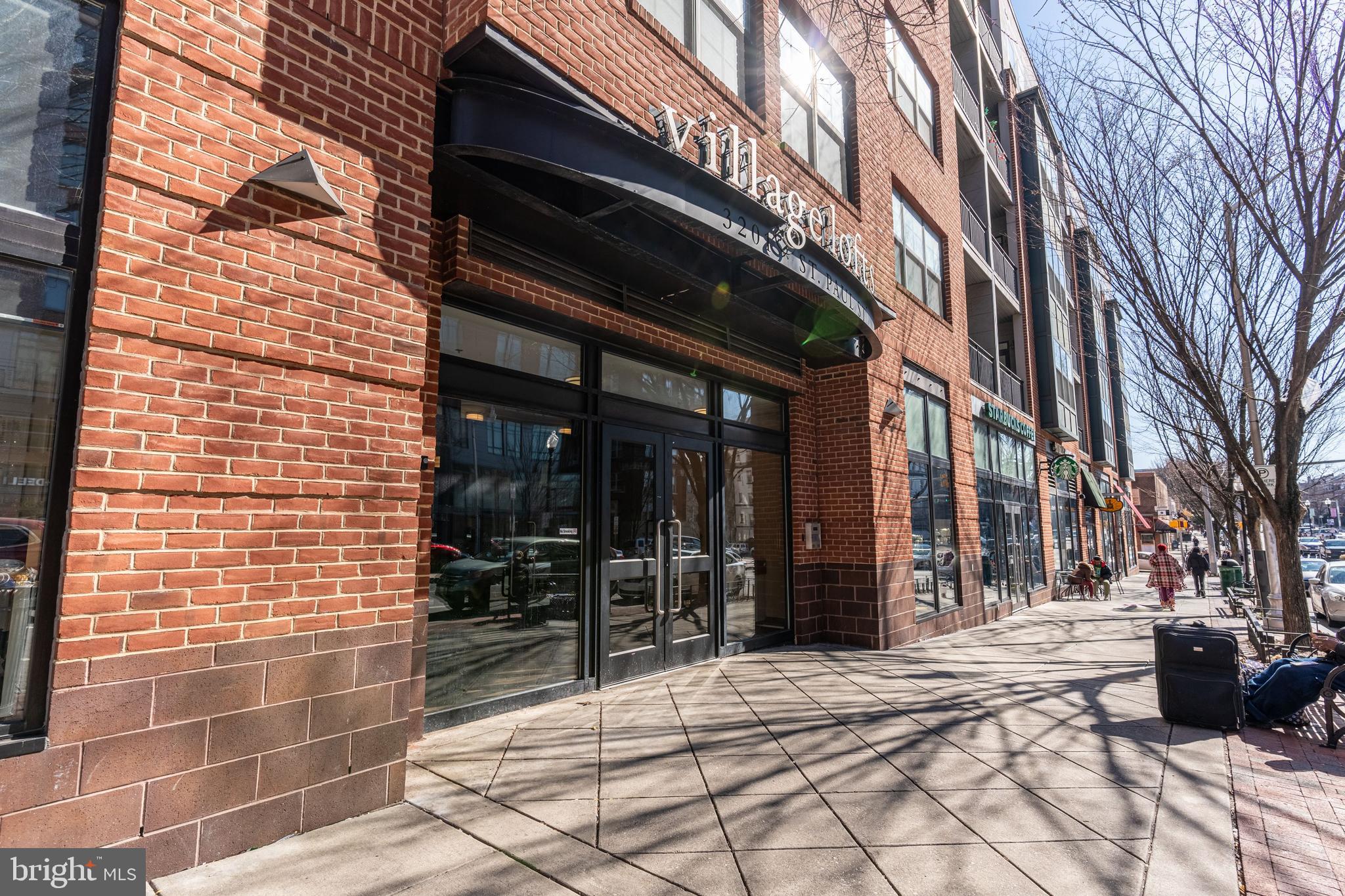3201 St Paul Street, Unit 422 Baltimore, MD 21218 - Photo 3 of 27 a view of a building with a outdoor space