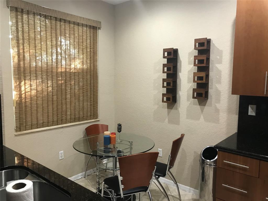 2851 Prospect Road, Unit 106 Fort Lauderdale, FL 33309 - Photo 4 of 6 a bathroom with a sink and a mirror
