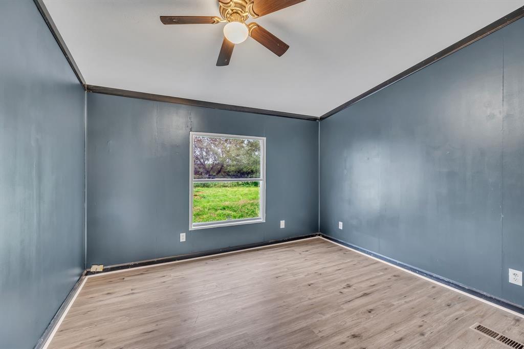 1350 Stephens Road Millsap, TX 76066 - Photo 14 of 29 wooden floor in an empty room with a window
