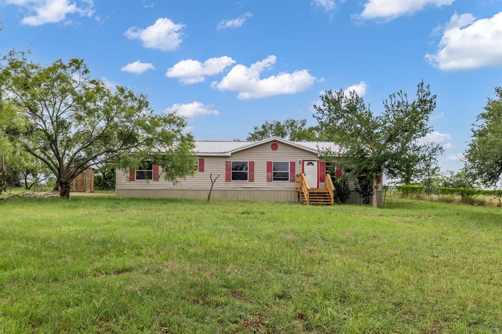 1350 Stephens Road Millsap, TX 76066 - Photo 2 of 29 a front view of a house with garden