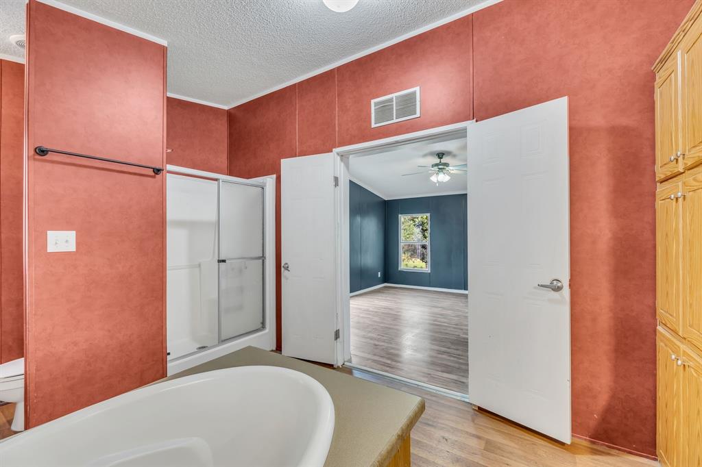 1350 Stephens Road Millsap, TX 76066 - Photo 23 of 29 a view of a hallway with wooden floor