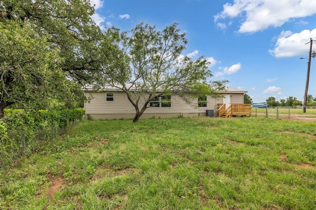 1350 Stephens Road Millsap, TX 76066 - Photo 25 of 29 a view of a house with a yard
