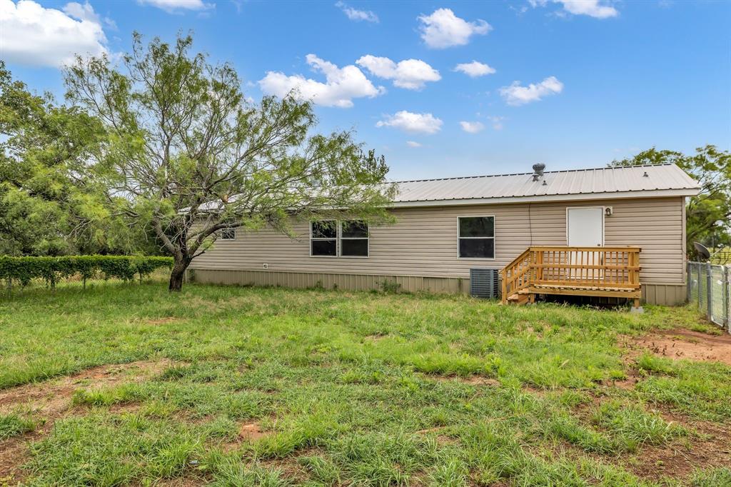 1350 Stephens Road Millsap, TX 76066 - Photo 27 of 29 a backyard of a house with barbeque oven table and chairs
