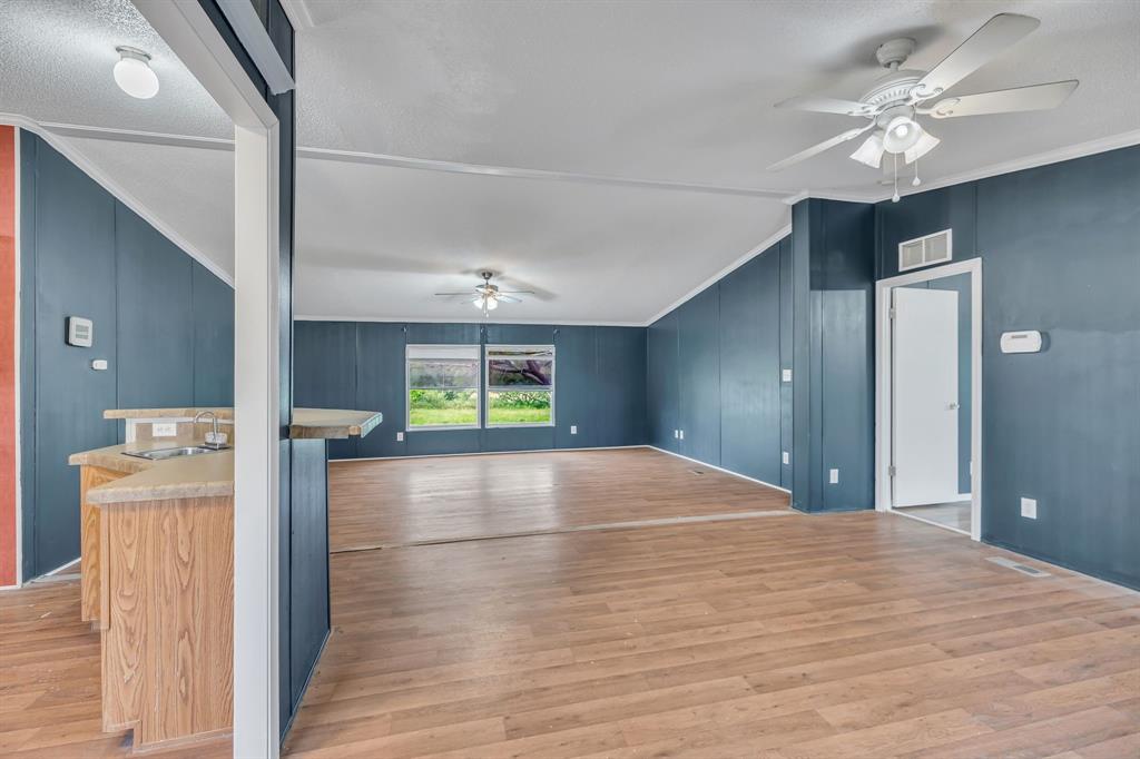 1350 Stephens Road Millsap, TX 76066 - Photo 5 of 29 a view of empty room with wooden floor