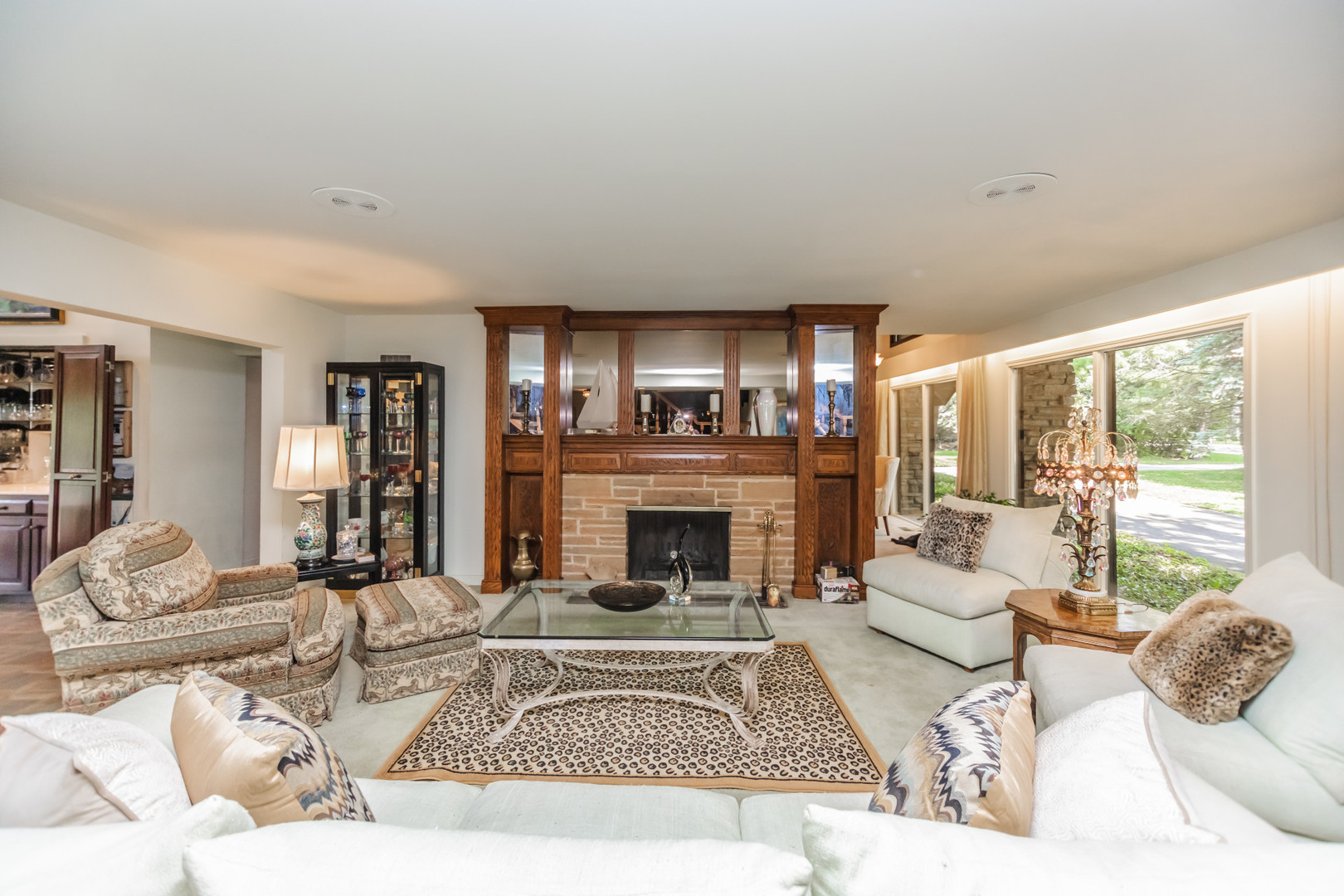 8080 Wolf Road Burr Ridge, IL 60527 - Photo 15 of 73 a living room with furniture large window and a fireplace