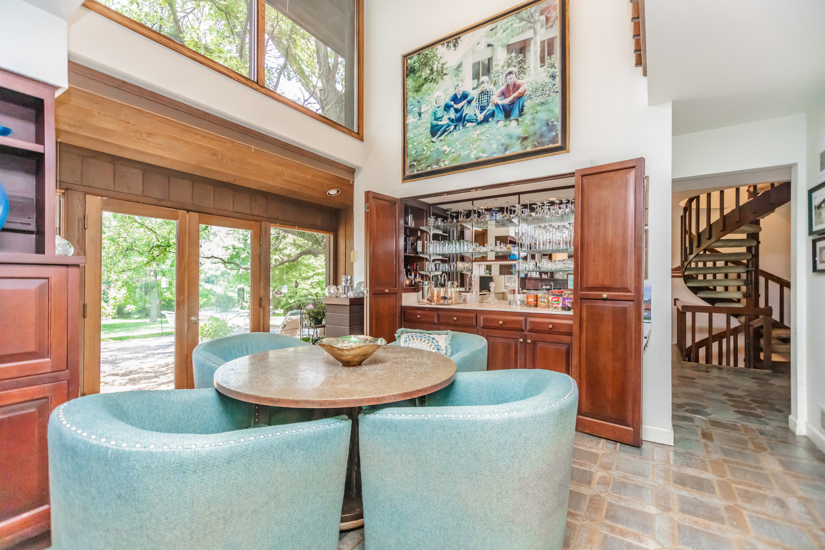 8080 Wolf Road Burr Ridge, IL 60527 - Photo 18 of 73 a dining room with furniture and a painting on the wall