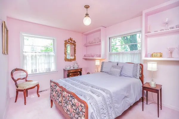 a room with lots of wooden floor and glass door