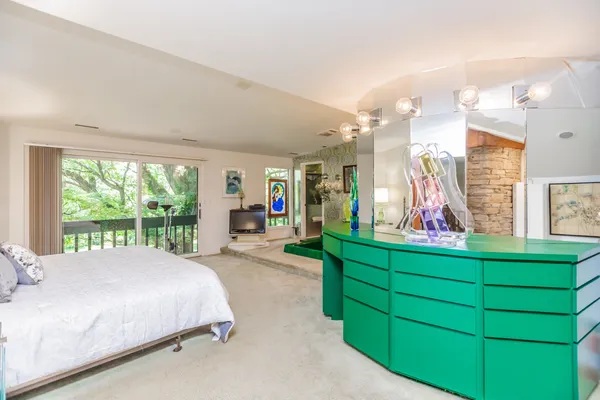a bedroom with bed and a lamp
