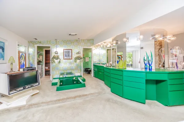 a room with furniture and potted plant
