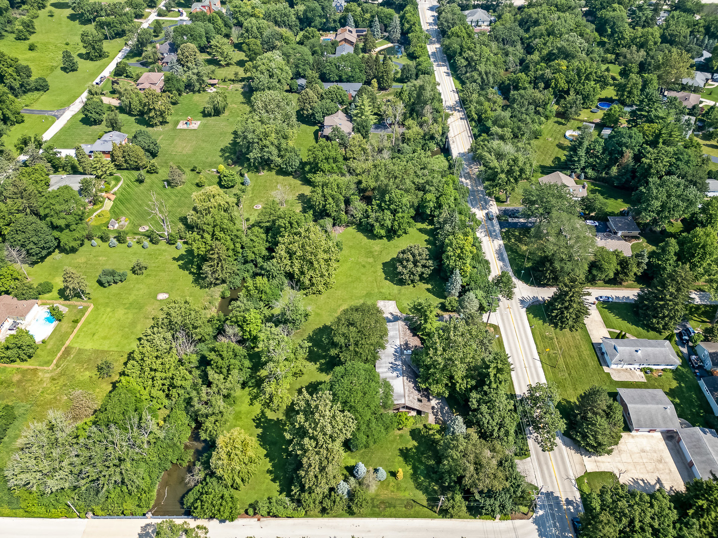 8080 Wolf Road Burr Ridge, IL 60527 - Photo 71 of 73 an aerial view of residential house with outdoor space and trees all around
