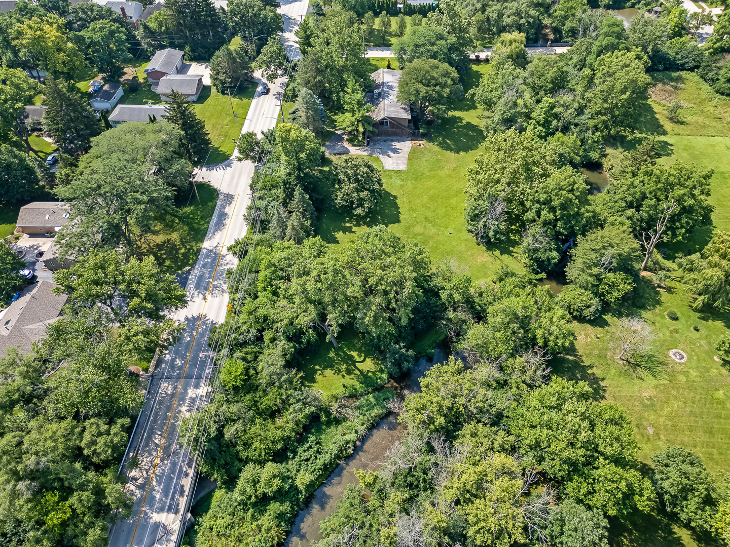 8080 Wolf Road Burr Ridge, IL 60527 - Photo 73 of 73 an aerial view of residential house with outdoor space and trees all around
