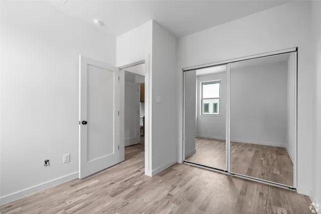 a view of entryway with wooden floor