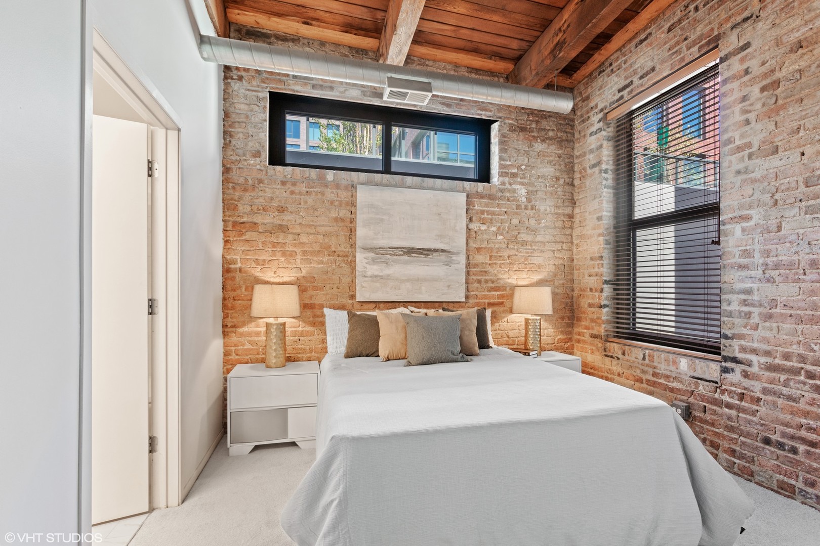 14 North Sangamon Street, Unit 309 Chicago, IL 60607 - Photo 12 of 39 a bedroom with a bed and a flat screen tv