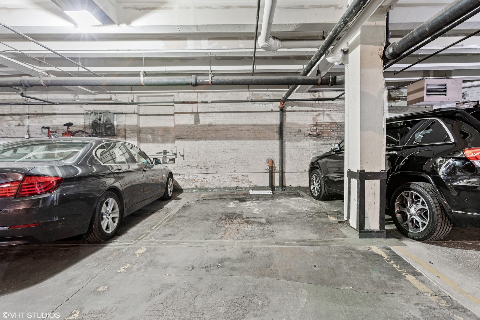 14 North Sangamon Street, Unit 309 Chicago, IL 60607 - Photo 20 of 39 a view of a garage with parked cars