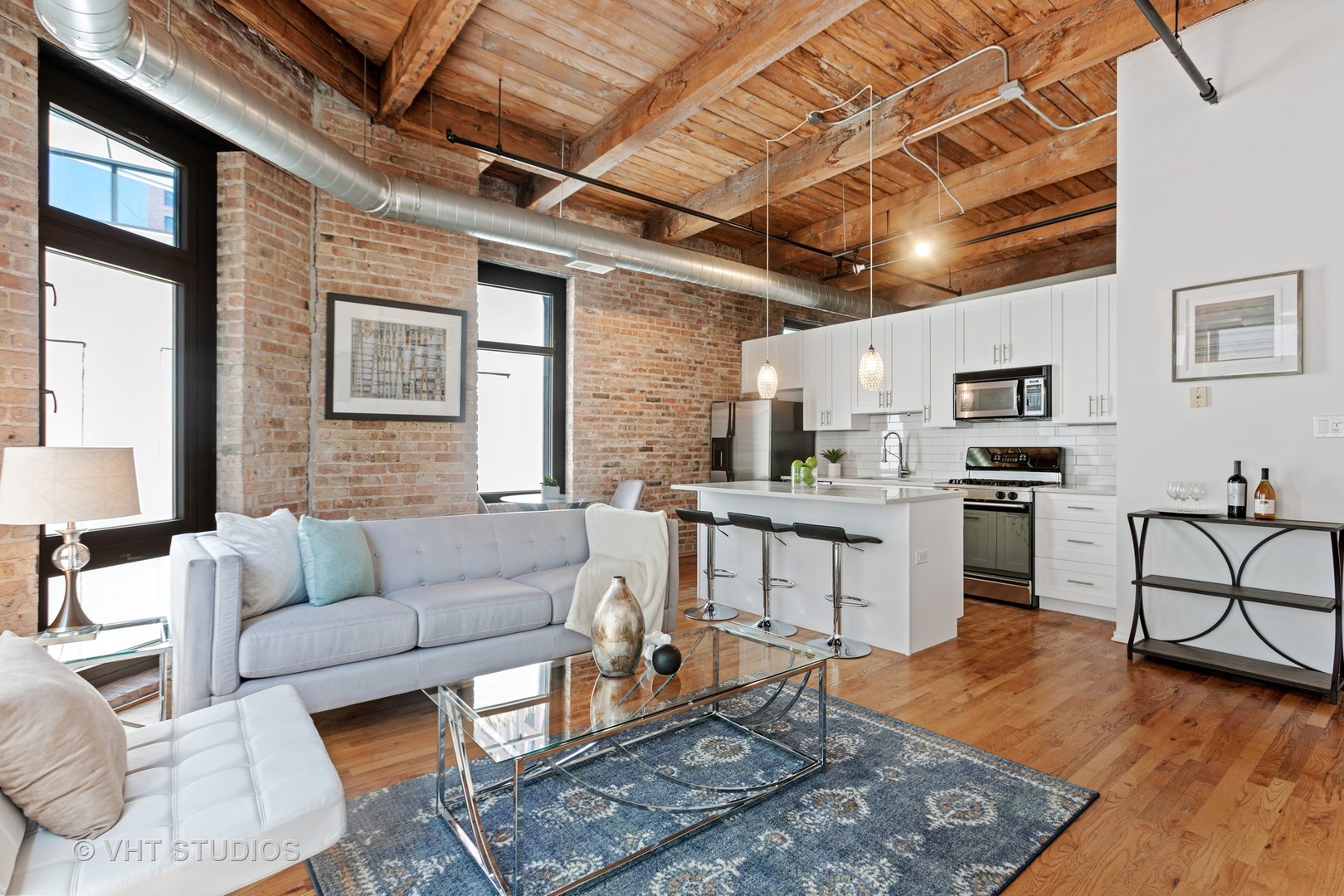 14 North Sangamon Street, Unit 309 Chicago, IL 60607 - Photo 24 of 39 a living room with furniture and kitchen view
