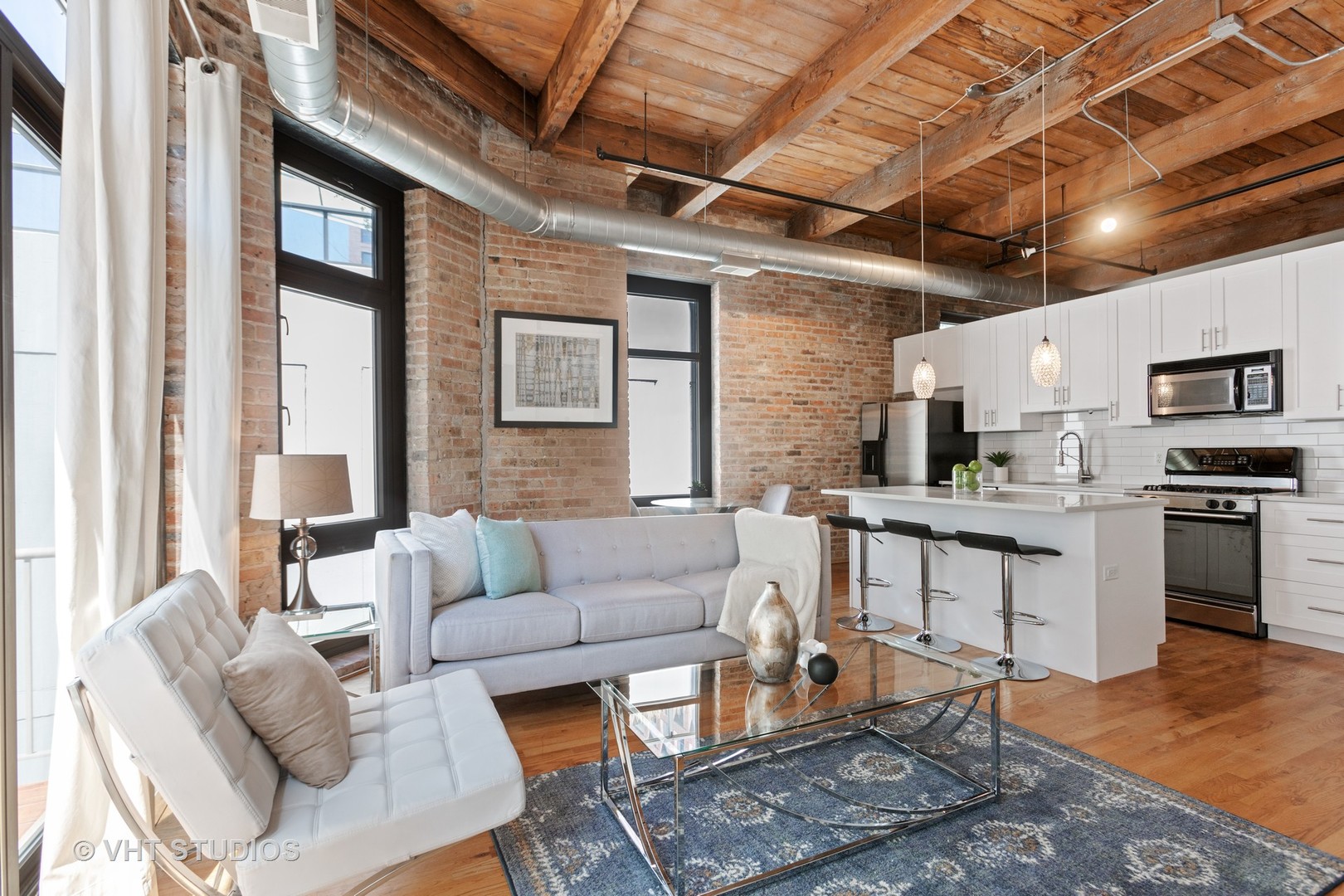 14 North Sangamon Street, Unit 309 Chicago, IL 60607 - Photo 29 of 39 a living room with furniture and kitchen view