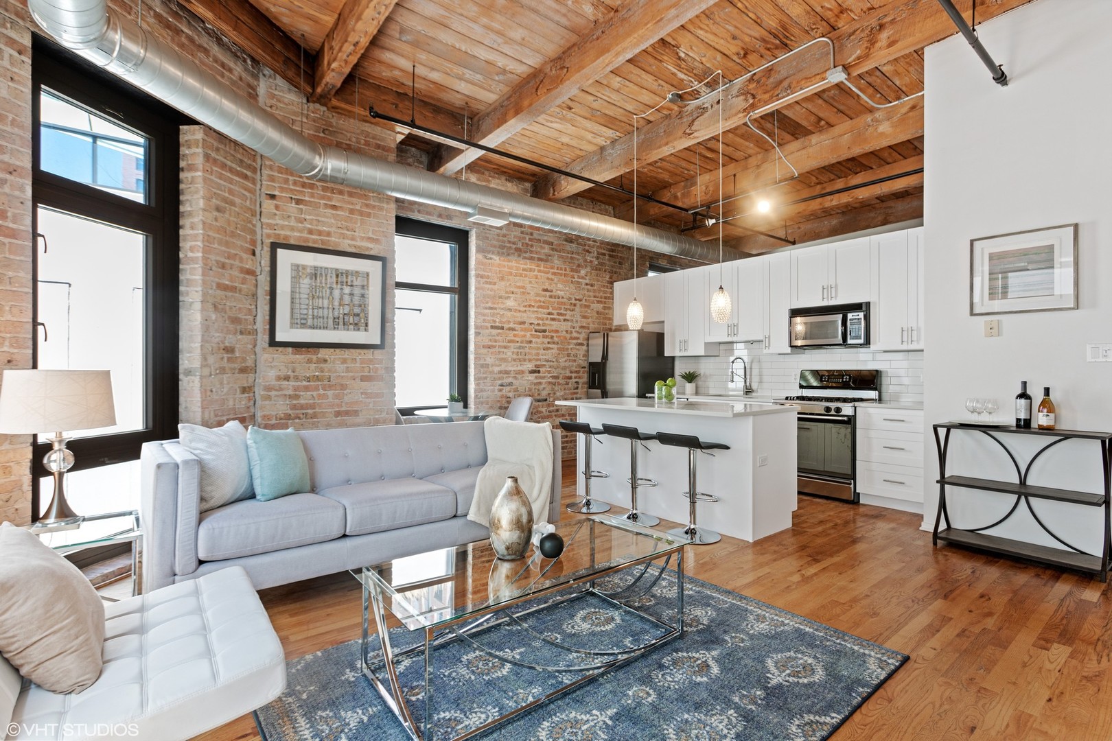 14 North Sangamon Street, Unit 309 Chicago, IL 60607 - Photo 5 of 39 a living room with furniture and kitchen view