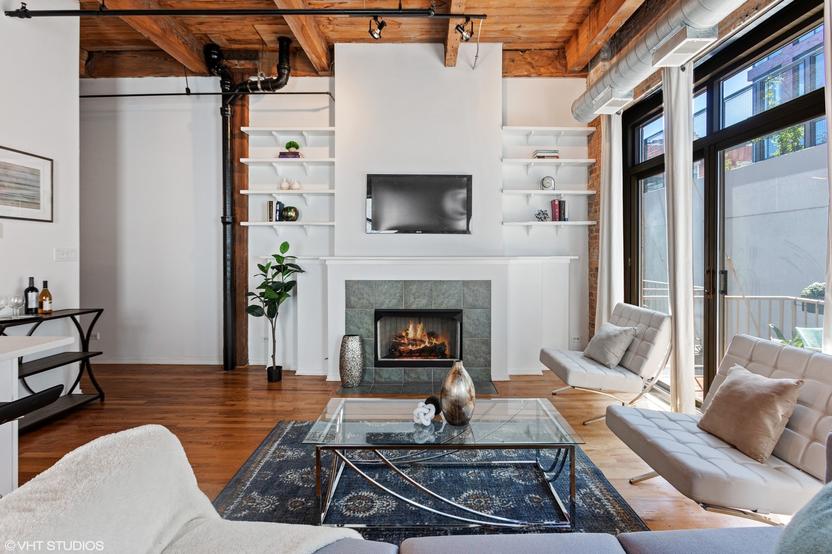 14 North Sangamon Street, Unit 309 Chicago, IL 60607 - Photo 7 of 39 a living room with furniture and a fireplace