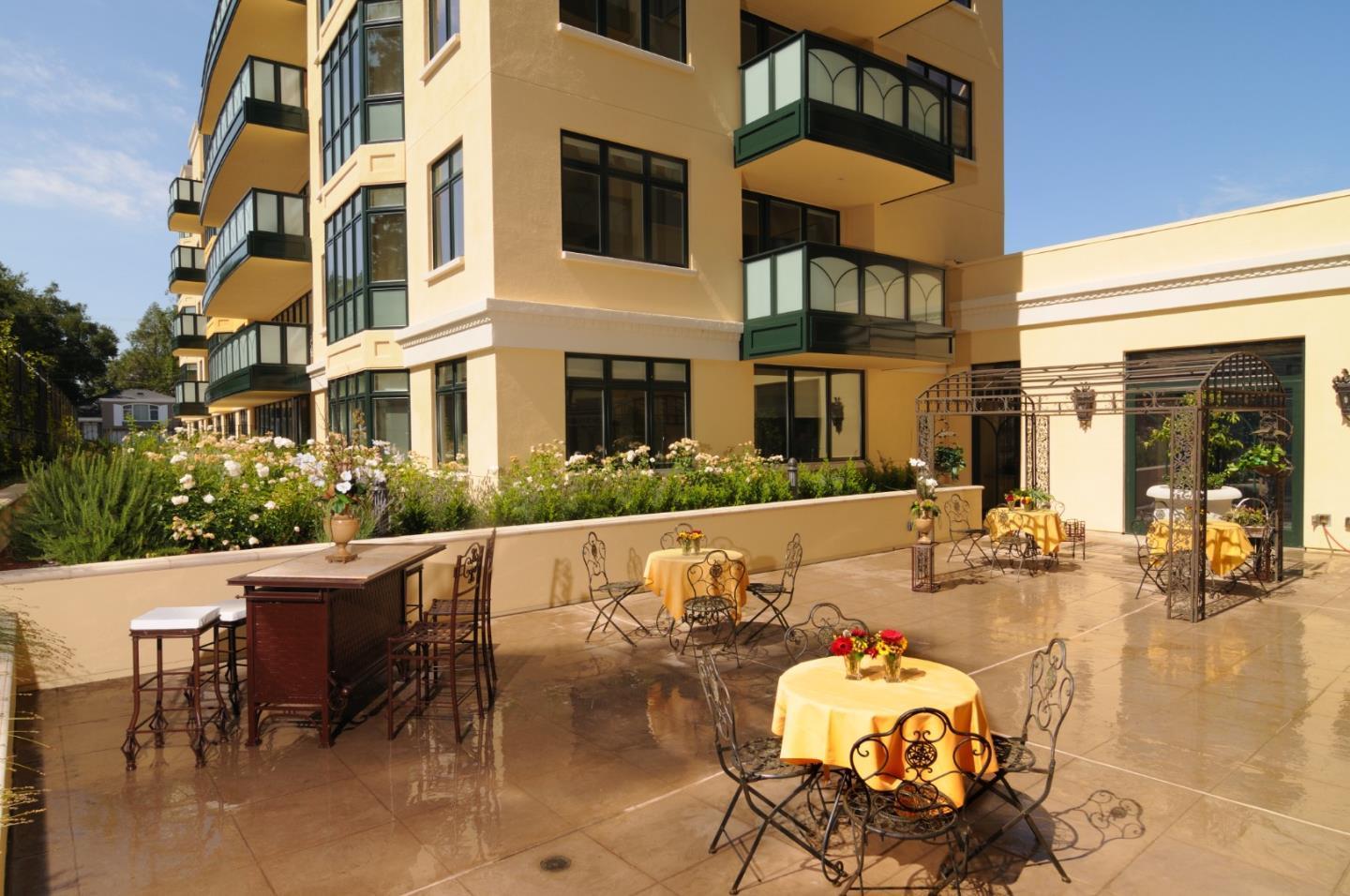 10 Crystal Springs Road, Unit 1507 San Mateo, CA 94402 - Photo 32 of 33 a front view of a building with dining table and chairs