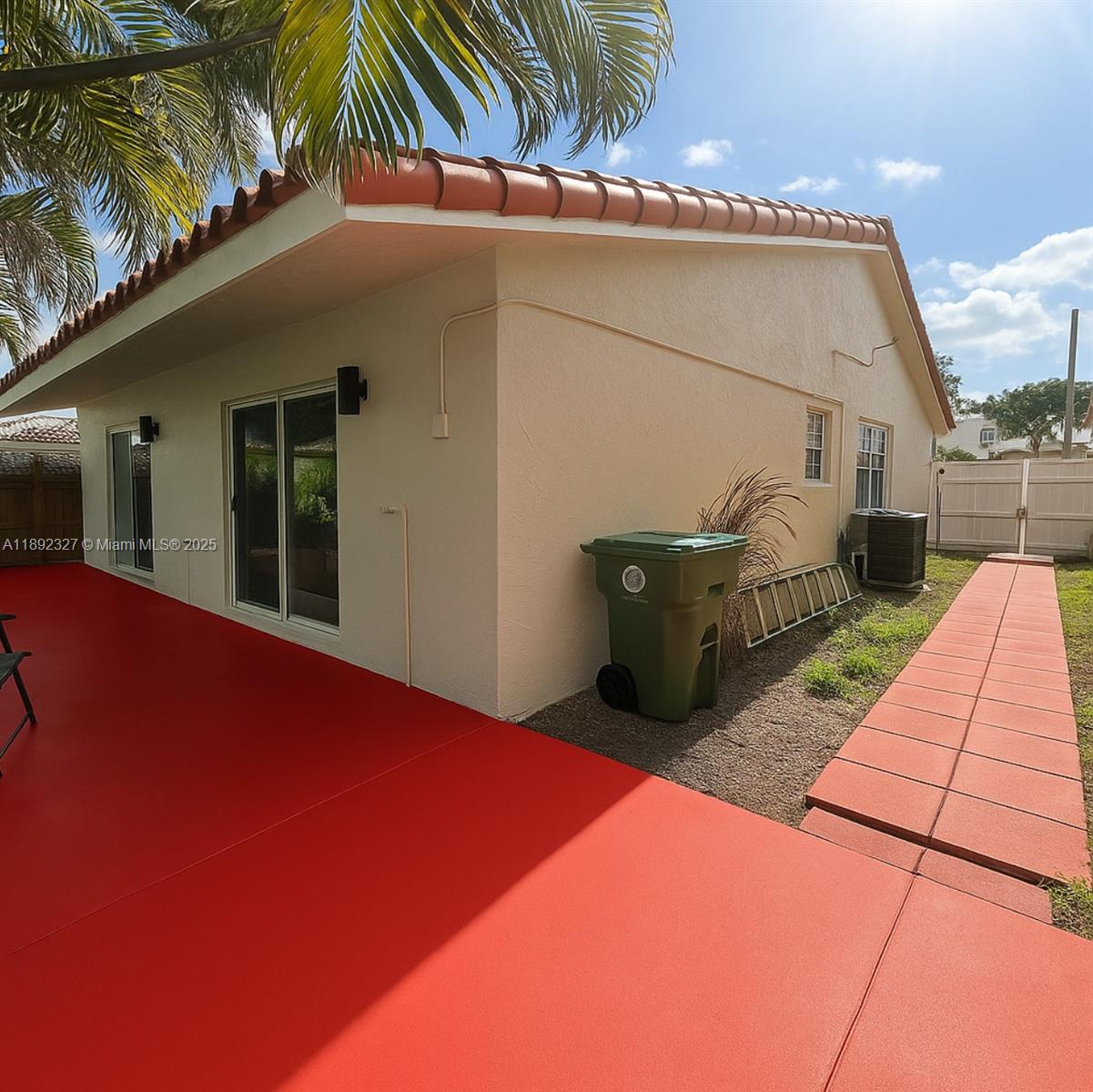 2849 West 71st Street Hialeah, FL 33018 - Photo 20 of 22 a backyard of a house with seating space